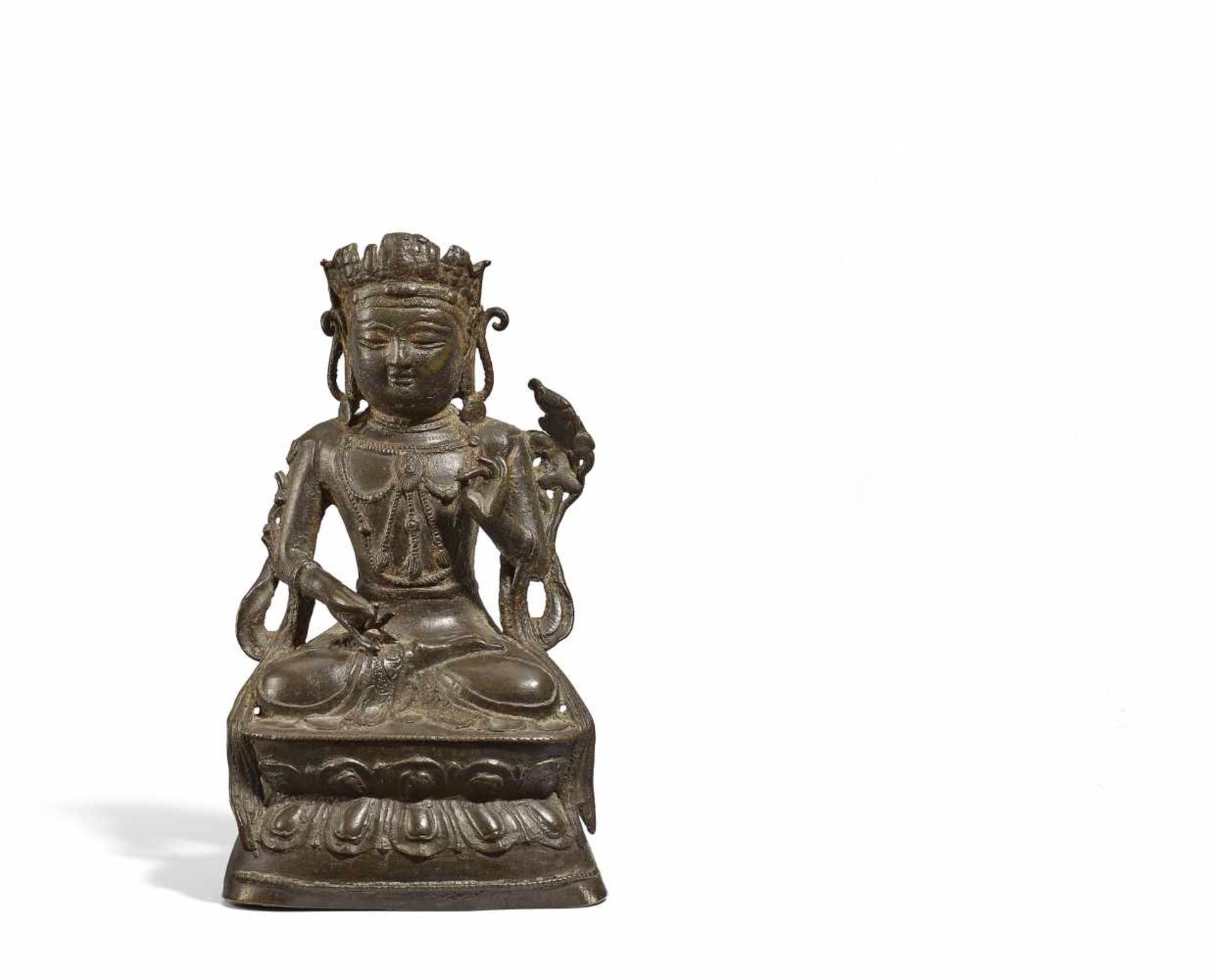 GUANYIN WITH PARROT. China. Ming dynasty, Jiajing period. Dated 1538. Bronze with dark patina and