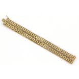 platte 14 krt. gouden armbandt, lengte: 18,5 cm., breed: 21 mm., gewicht: 37 gram- - -29.00 %