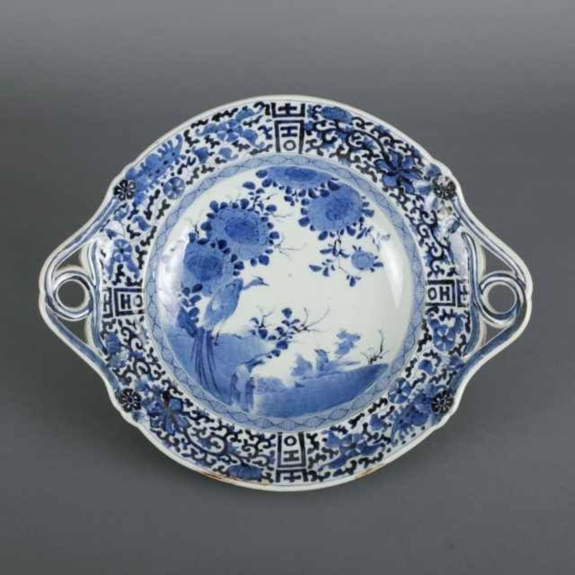 Blue and white porcelain tazza decorated with birds and flowers motif, the border with karakusa