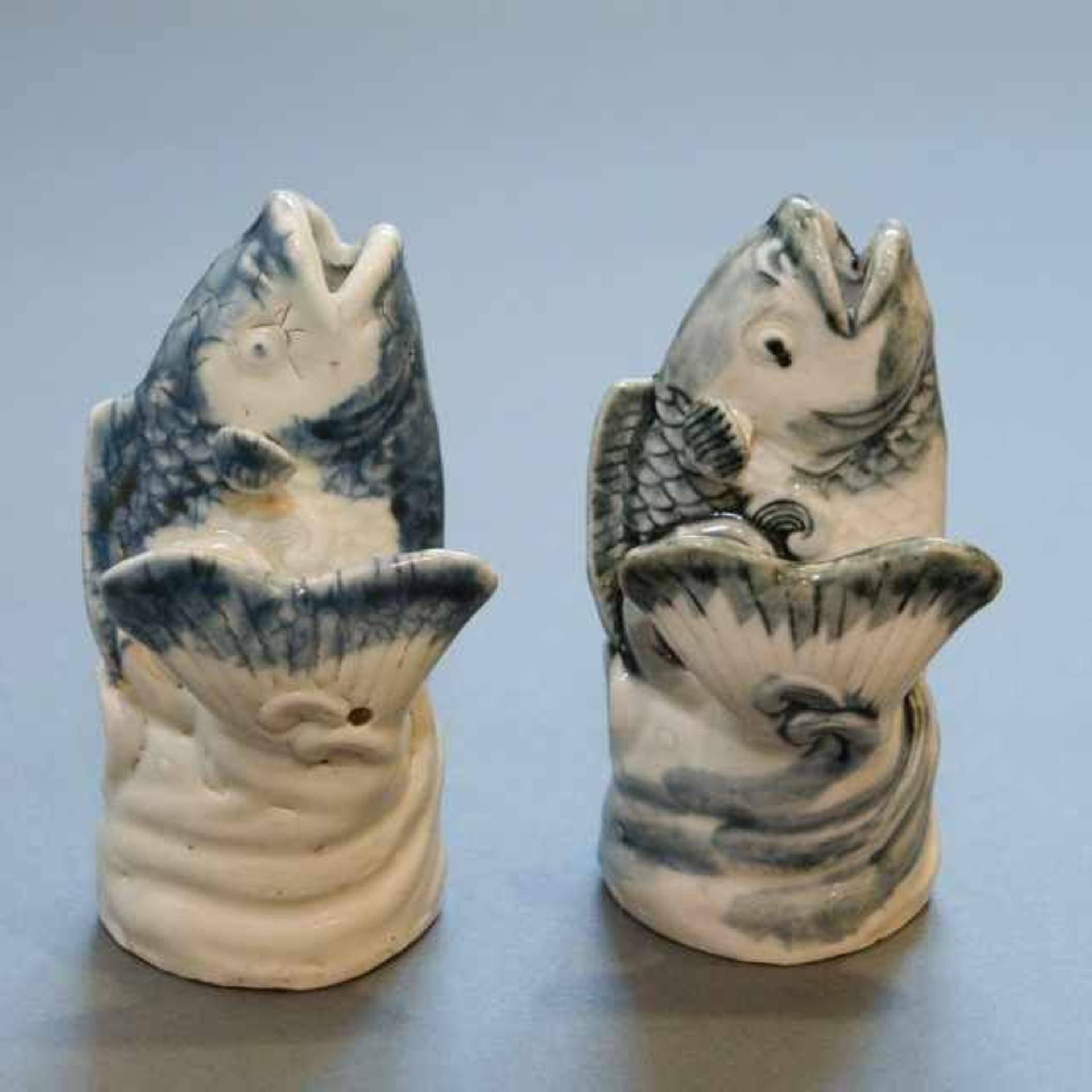 Two blue and white porcelain Arita vases in the shape of a leaping carp, Japan, not signed, around