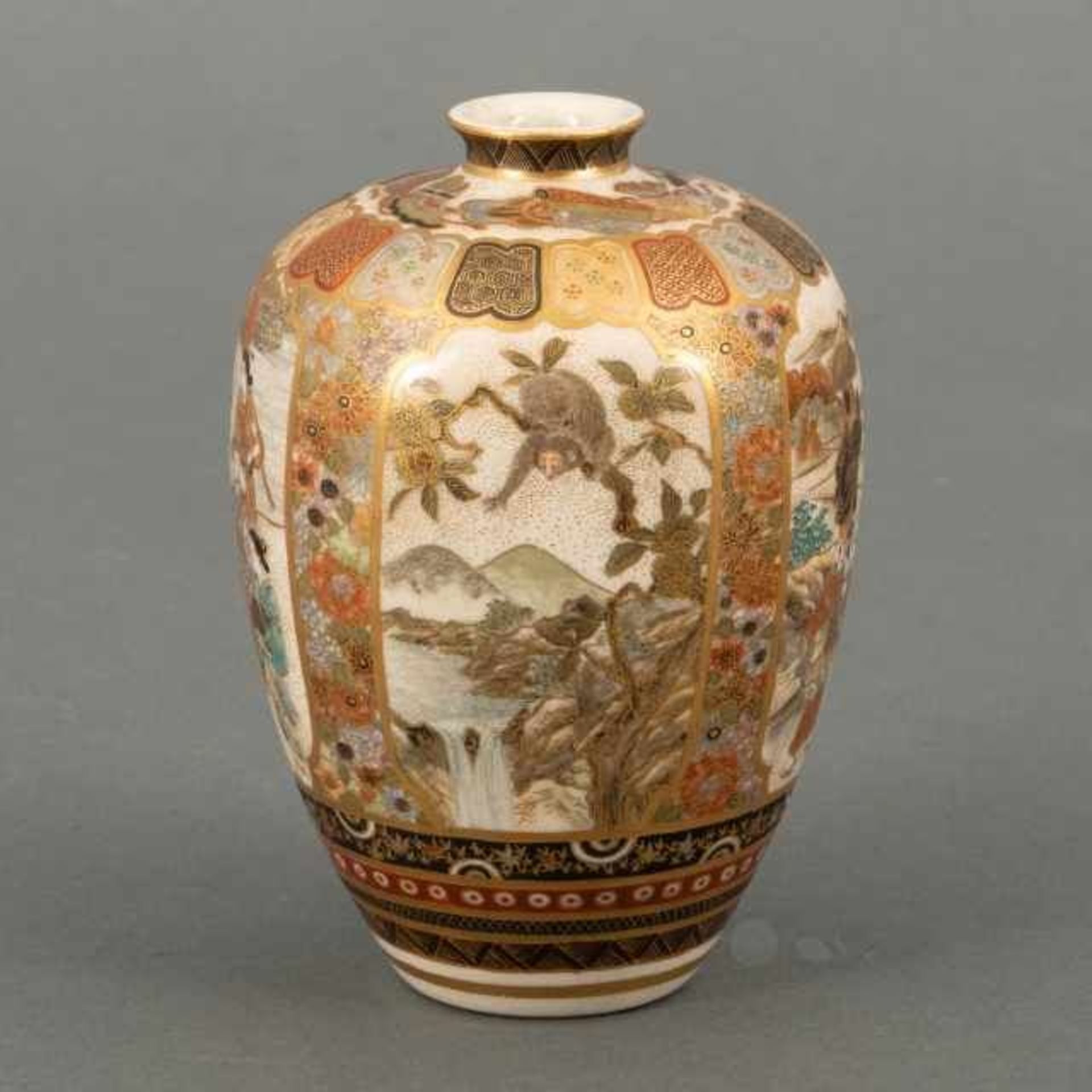 Small Satsuma vase decorated with four different scenes in cartouches: a monkey trying to grasp a