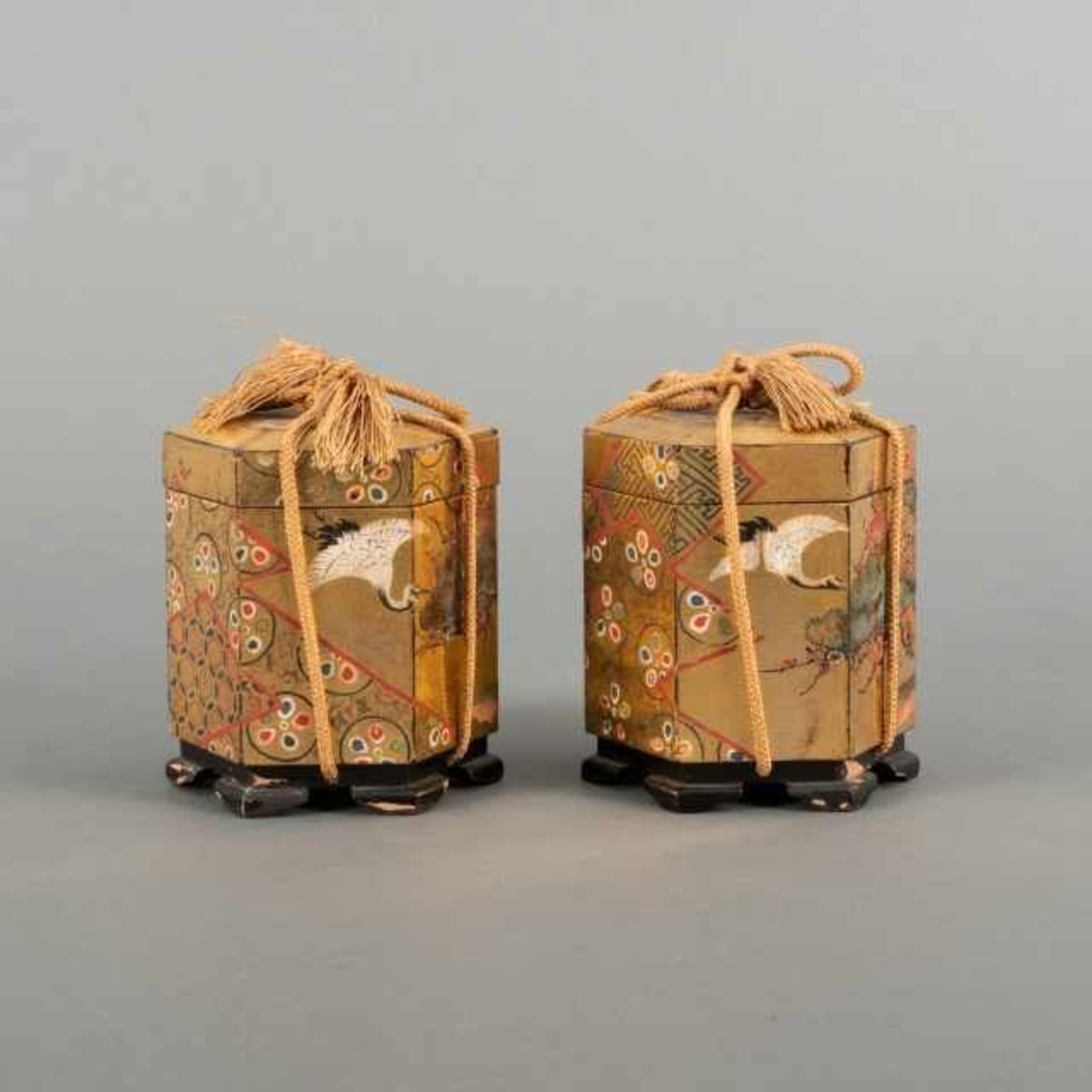 Pair of golden lacquer kaioke, or shell boxes, with polychrome painted motif of cranes and sakura
