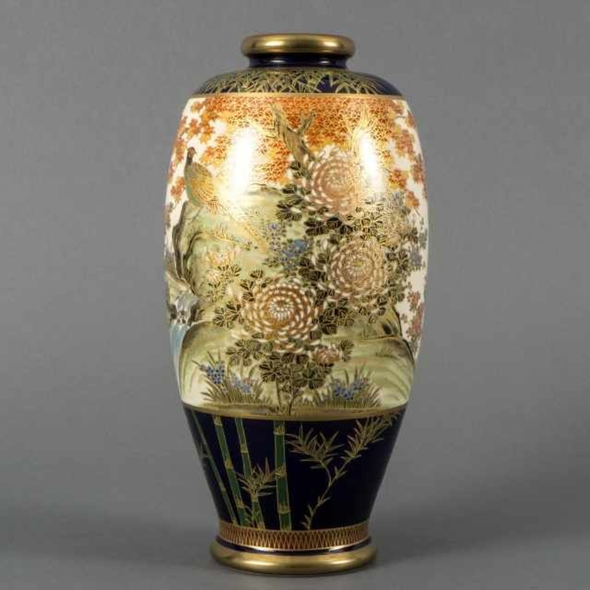 Satsuma vase with elaborate motif of birds, flowers and landscape in cartouche, the background is