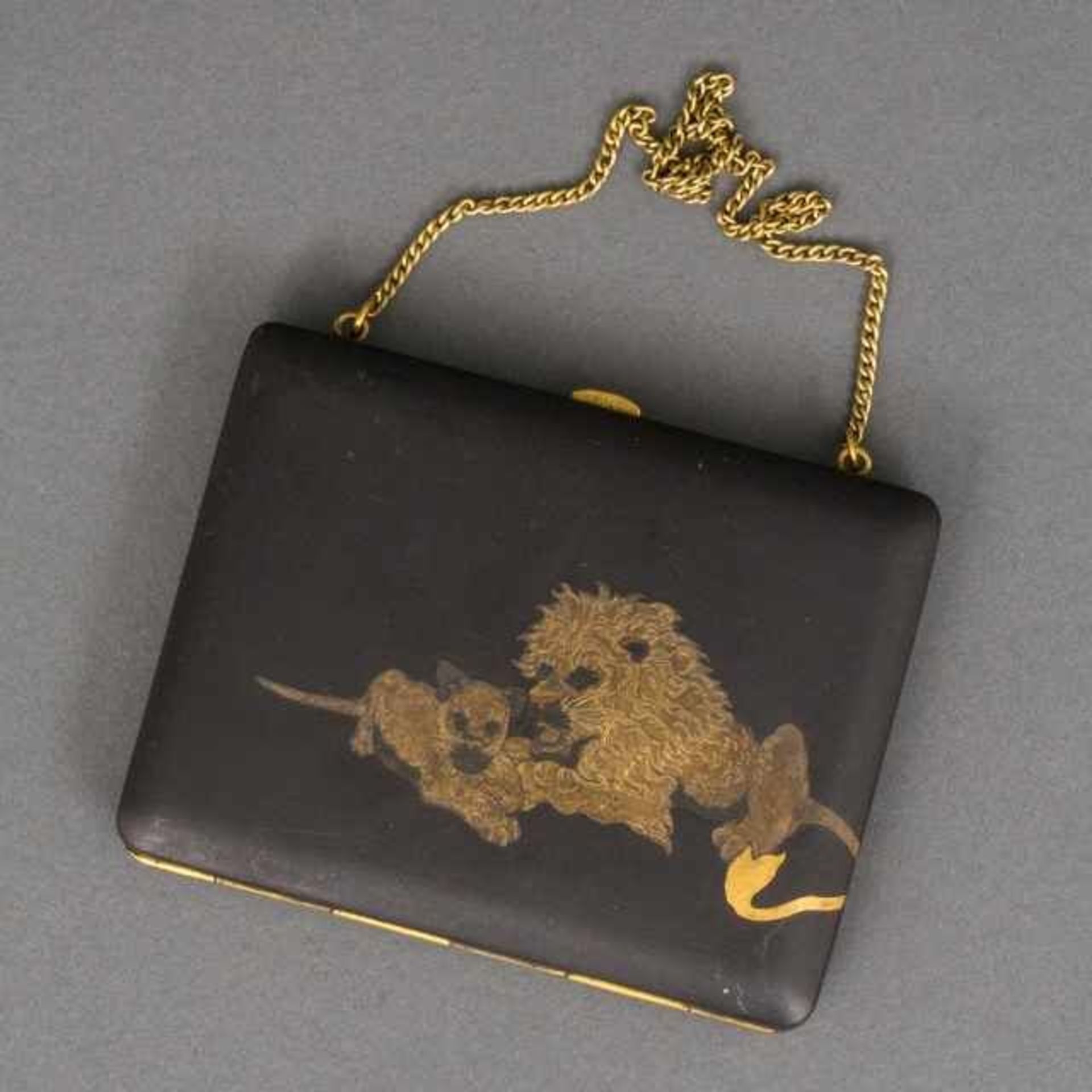 Metal ladies compact and cigarette case, the lid with engraved decoration of two lions, the inside