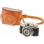 Een spionage camera - Mycro - in originele lederen tas.A spy camera - Mycro - in original leather