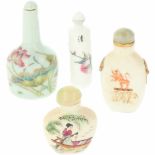 Een lot van vier porseleinen snuff bottles. China, 2e helft 20e eeuw.A lot with four porcelain snuff