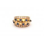 A yellow gold set of earrings and ring. Italian. Set with cabochon cut sapphires and brilliant cut