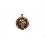 A yellow gold locket. Belle Epoque. Blue glass. Flower basket and rim set with split pearls. Blue