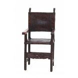 An oak armchair, the worked leather seat and back later. With reconstructions. Presumably Spain,