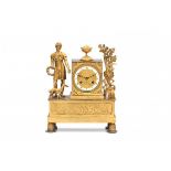 An ormulu bronze Empire mantle clock, with a figure of a boy holding a wreath and his dog. Adress