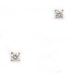 Pair of 14 krt white gold solitaire earrings. Set with brilliant cut diamonds with IGI report,