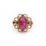 A 14 krt yellow gold ring. Set with oval double cabochon cut, natural Burma ruby. Internal fractures