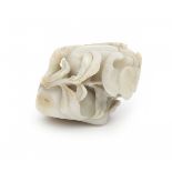 Een Chinese jade sculpture, carved with two bats and peaches. 20th century.Circa 10 x 10 x 7 cm.