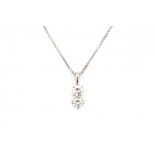 A white gold necklace and pendant. Set with two brilliant cut diamonds, ca. 0.45 ct and 0.55 ct,