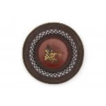 A Japanese lacquer plate the centre with part gilt bronze applique of a monk. With basket woven