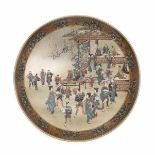 A Japanese Satsuma plate, decorated with a busy market square. With three character mark Kinkozan,