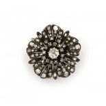 A 18 krt yellow gold flower shaped brooch. Late 19th - early 20th century. French. Set with old