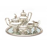 A five-piece English silver tea and coffeeservice with tray. Hallmarked Birmingham. No date