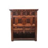 An oak Gothic style cabinet, the richly carved front with five doors and eight drawers. 19th