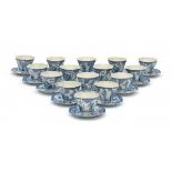 A set of fifteen octagonal Japanese blue and white cup and saucers, decorated with alternating