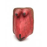 A red pigmented wooden body mask 'lipiko', used for initiation rituals into womanhood. Makonde