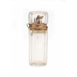 A cut crystal scent bottle with gold mounts, the inner stopper with bird finial. 19th