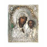 A Russian Mother of God icon with a silver riza, dated 1864. 19th century22,5 x 18 cm.