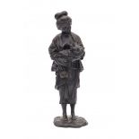 A Japanese bronze sculpture, a mother holding her child and carrying a tetsubin. Signed on base with