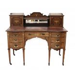 An Edwardian inlaid rosewood desk by James Schoolbred & Co. One of the drawers is stamped with the