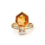 A 14 krt yellow gold ring. Modern. Set with a fancy cut citrine and three brilliant cut diamonds,