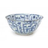 A large Chinese blue and white 'kraak' bowl, decorated with flowers and western landscapes in