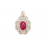 A golden pendant. Set with a cabochon cut rounded rectangular, synthetic ruby, length ca. 20.5 mm