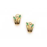 A pair of 18 krt yellow gold earrings. Set with facetted emeralds and brilliant cut diamonds,