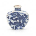 A Chinese blue and white snuffbottle, decorated on both sides with a dragon.Marked with four