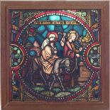 A square stained glass window, depicting Joseph and Mary with text 'Accipe puerum et fuge in