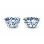 A pair of Chinese blue and white bowls, decorated on the inside with a chakra pattern below a