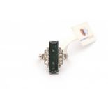 A 9 krt white gold ring. Art Deco. Set with a rectangular cut, green tourmaline, ca. 15.35 ct and