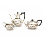 A three-piece silver tea and coffee service. Hallmarked Chester. Maker's mark Barker Brothers.