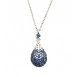 A 18 krt white gold drop shaped pendant on necklace. Italian. Set with sapphires, total ca. 1.65 ct,