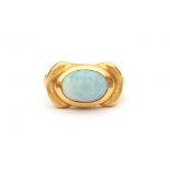 A 18 krt yellow gold ring. 1960's. Set with a cabochon cut opal. Gold surface is hammered. Maker's