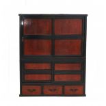 A Japanese cabinet 'tansu', the front with sliding doors and three drawers. Meiji period (1868-