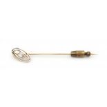 A 14 krt yellow and white gold lapel pin. Set with rose cut diamond. Gross weight ca. 3.9 grams.