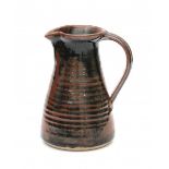 David Andrew Leach (1911–2005)A tenmoku glazed stoneware pitcher, after Medieval examples, produced