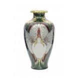 N.V. Haagsche Plateelfabriek Rozenburg, Den Haag (1883-1917)A tall ceramic vase decorated with