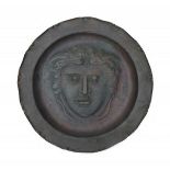 Conrad Fehn (1891-?)A pewter-plated copper wall plate with central decoration of Medusa, signed C.