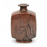 Bernard Howell Leach (1887-1979)A rectangular section tenmoku glazed stoneware vase decorated with