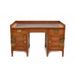 Karel Sluyterman (1863-1931)An oak twin-pedestal writing desk with two drawers and two cupboard