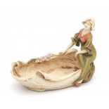 Royal DuxA porcelain shell-shaped bowl with a seated woman, circa 1900-1910, model 835, marked with