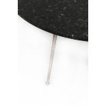 Midcentury ModernA circular coffee table on three metal feet and with black stone top, Italian,