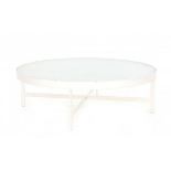 Janni van Pelt, attributedA circular white lacquered metal coffee table with wired glass top,